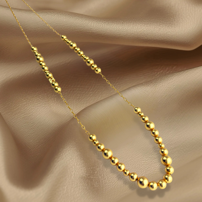 Long Dotti necklace matt gold plated